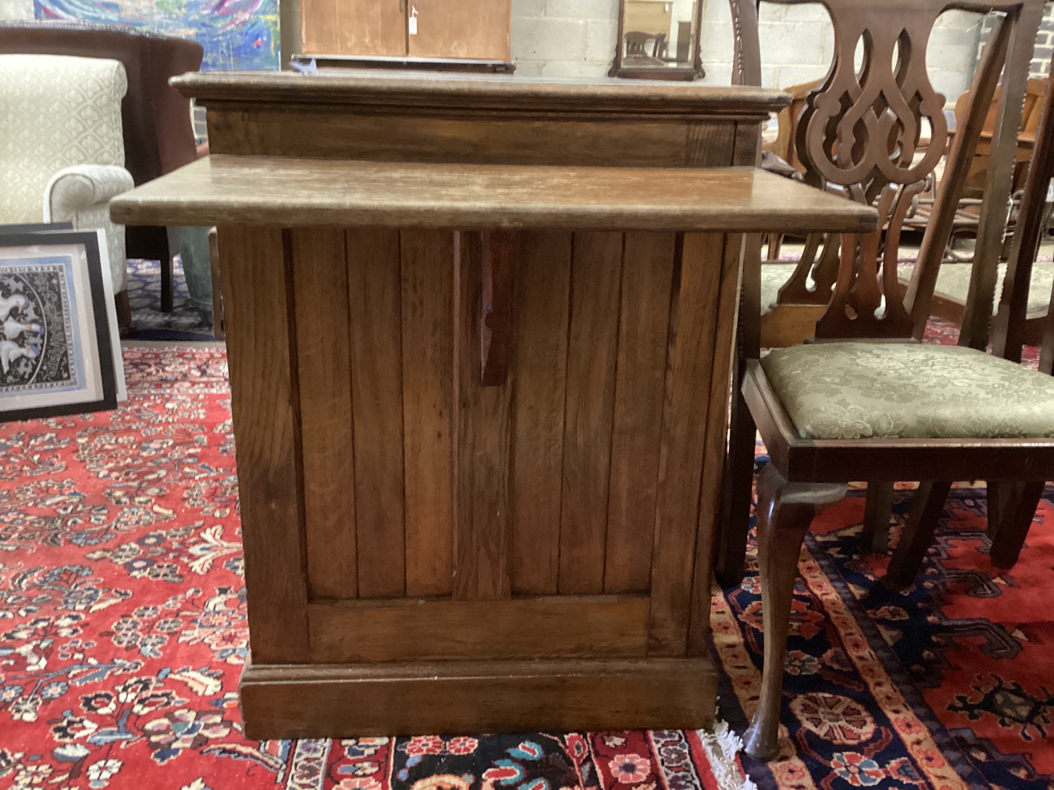A late Victorian oak drop flap kneehole desk, length 130cm, depth 66cm, height 84cm